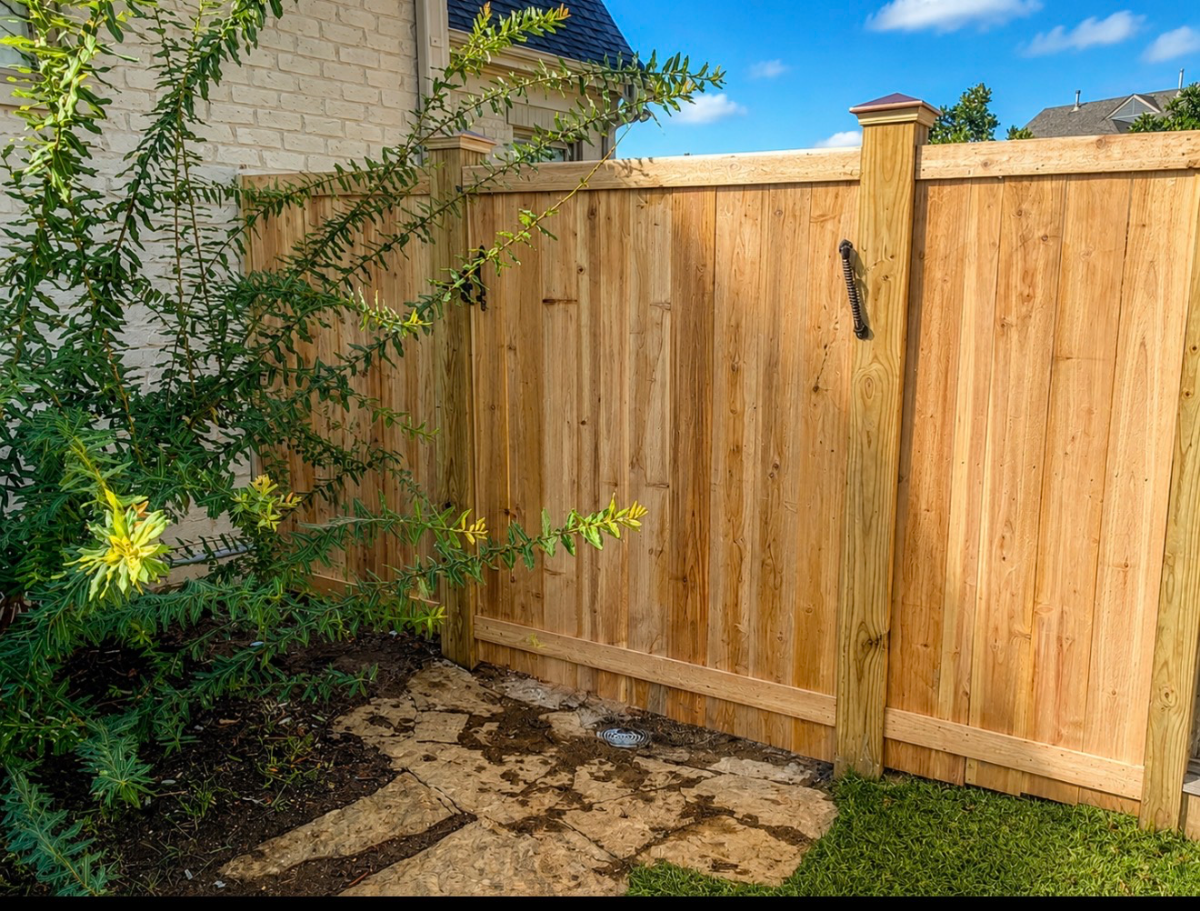 Cedar picture frame fence along a residential backyard