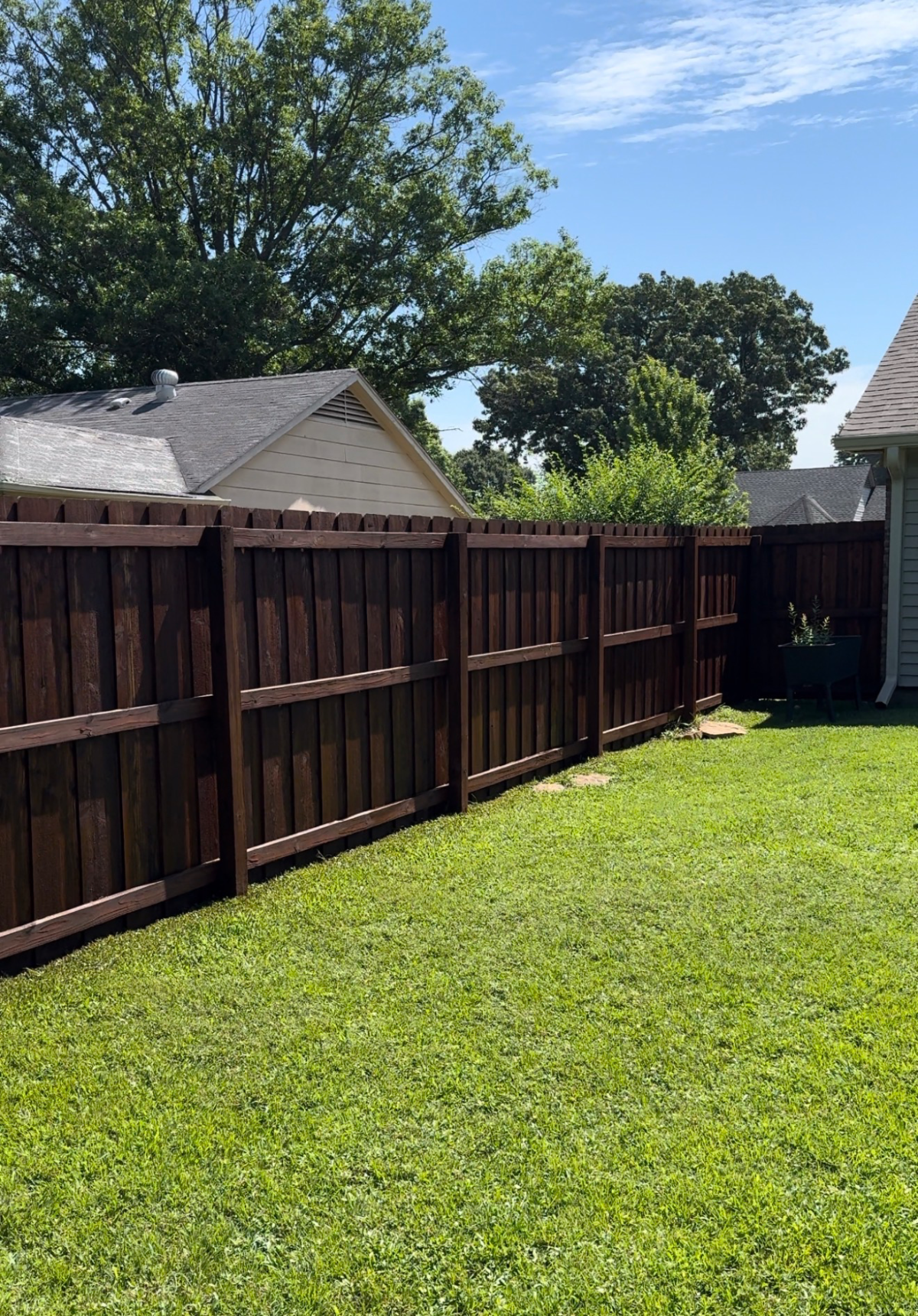 Cedar fence along a residential backyard